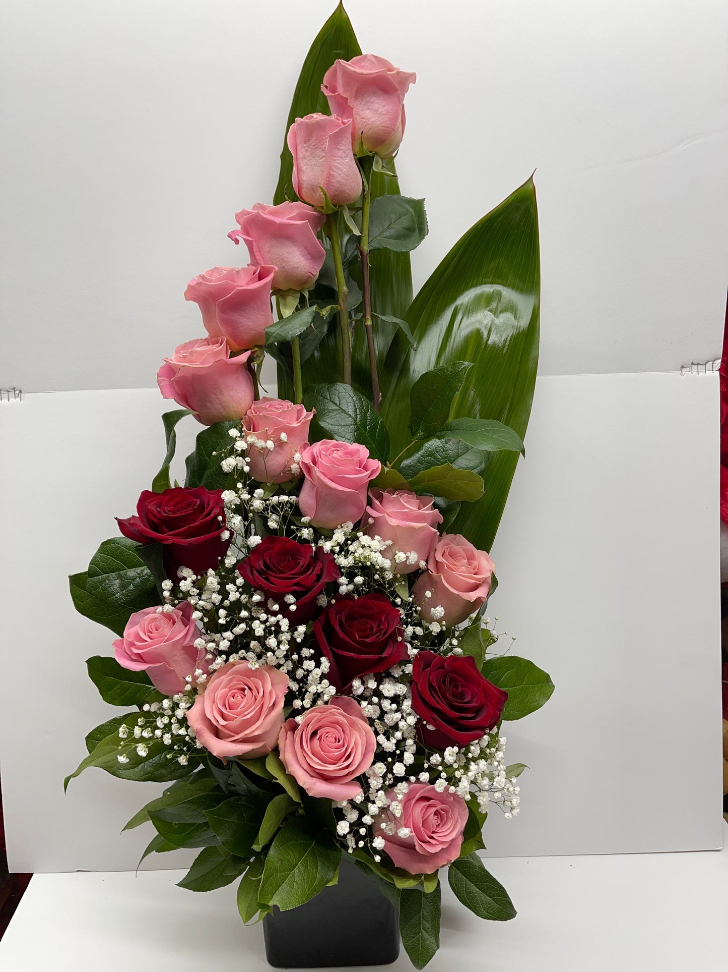 Beautiful Arrangement of Light Pink and Red Roses in ceramic vase image 0