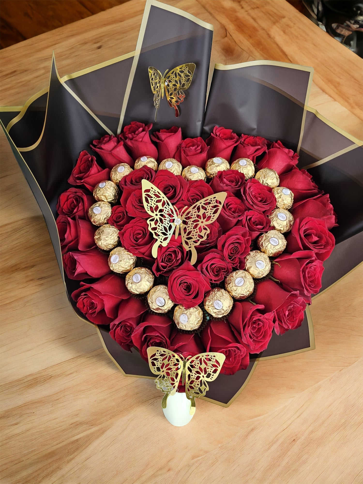 Bouquet of Precious Red Roses and Chocolate in a Heart Shaped wrapped in Black image 0
