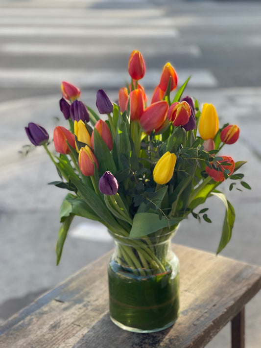 25 Beautiful tulips arrangement in clear glass vase  image 0