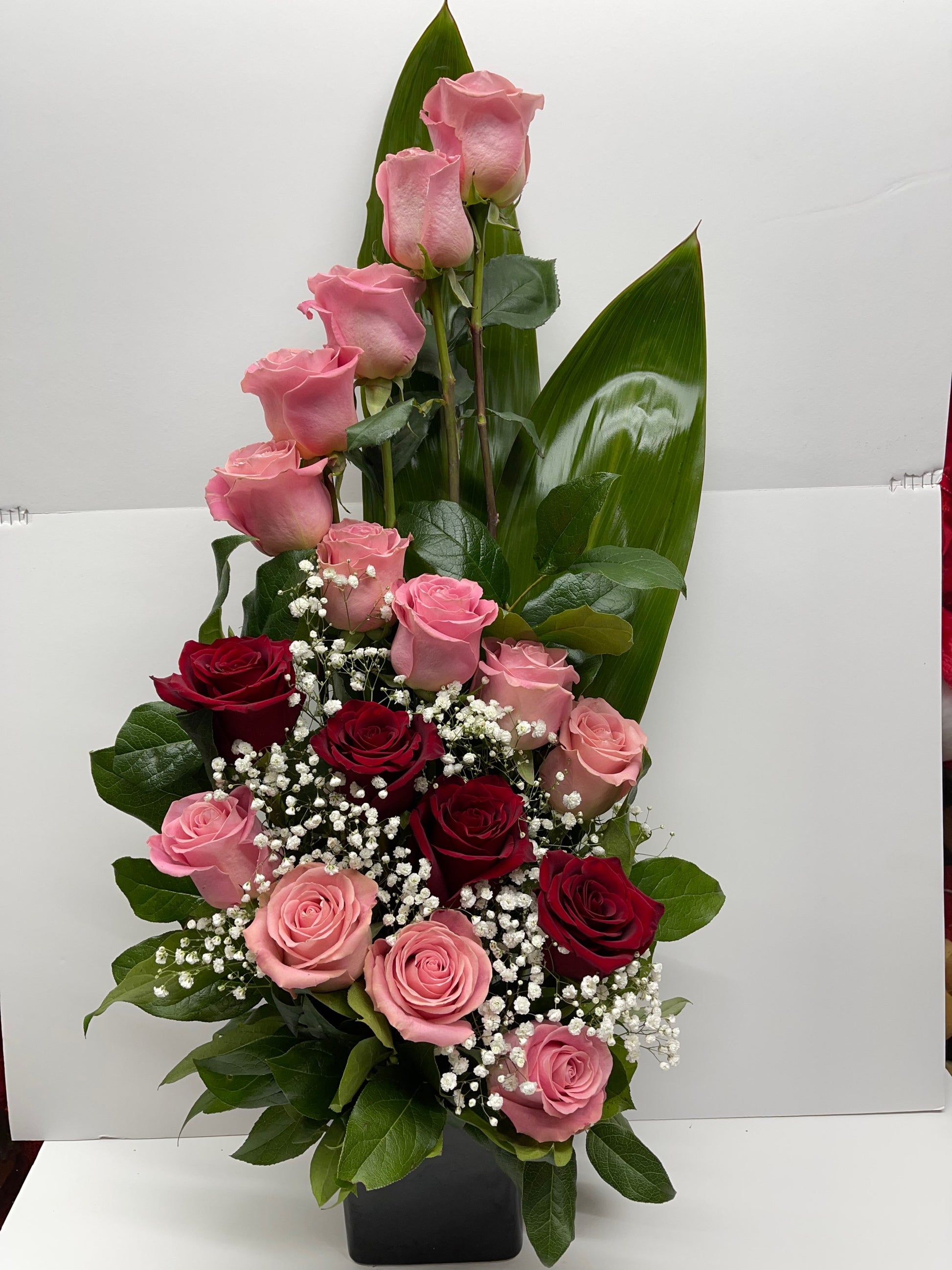 Beautiful Arrangement of Light Pink and Red Roses in ceramic vase  image 0