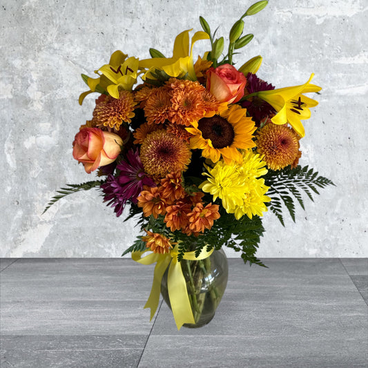 Autum Flower arrangement in clear vase  image 0